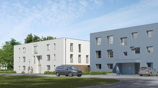 Im Wohngebiet „Mitten im Feld 1“ in Heddesheim soll bis 2021 das Pilgerhaus (blau) entstehen, im „Haus 21“ (links) gibt es zehn Eigentumswohnungen.