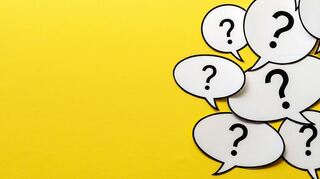 Multiple question marks in speech bubbles forming side border o a bright yellow background with copy space