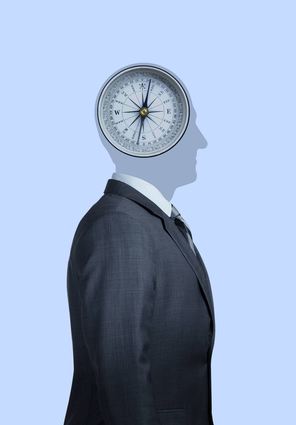 A silhouette of a businessman as he stands profile to the camera.  A compass occupies his head which represents the moral complexities and dilemmas that occupy our thoughts.