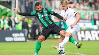Andrew Wooten (l.), hier gegen Waldhof-Spieler Fridolin Wagner, wird wohl nicht mehr länger für Münster auflaufen. Der VfR Mannheim zeigt Interesse.