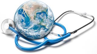 Global human health in context of coronavirus pandemic. Stethoscope wrapped around globe Earth on white background. banner. Elements of this image were furnished by NASA